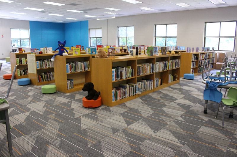 Perkerson Elementary School has updated its library with new books, fresh paint and carpet -- just one way the school has changed in the last year. Jenna Eason / Jenna.Eason@coxinc.com