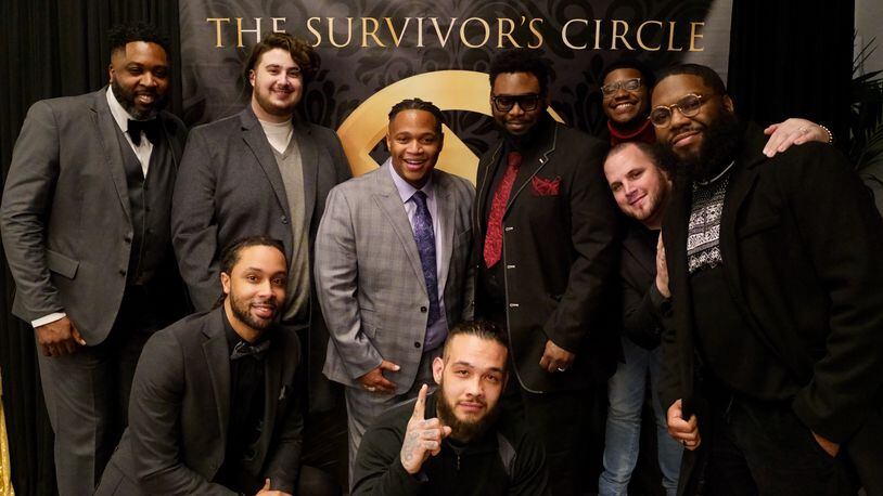 Nearly one in three men experience some form of sexual violence in their lifetimes. In 2019, Robert Marshall Jr. (center, in gray) began hosting events for male survivors of sexual abuse. Marshall's "We Survived Live" comes to Atlanta Oct. 7. (Courtesy of Robert Marshall Jr.)