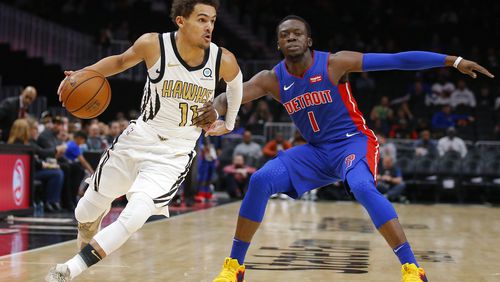 Hawks guard Trae Young (11) drives to the basket as Detroit Pistons guard Reggie Jackson (1) defends during the first half of an NBA basketball game Friday, Nov. 9, 2018, in Atlanta. (AP Photo/Todd Kirkland)
