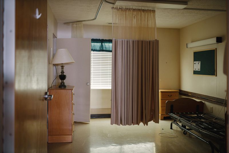 A curtain partitions a patient’s room in the now-closed Gray Health and Rehabilitation nursing home, owned by Rollins. (Melissa Golden/Redux, special to ProPublica)