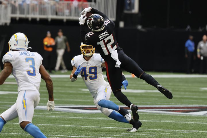 Falcons wide receiver KhaDarel Hodge catches a pass as Chargers linebacker Drue Tranquill pursues during the third quarter Sunday in Atlanta. The Chargers defeated the Falcons 20-17. (Miguel Martinez / miguel.martinezjimenez@ajc.com)
