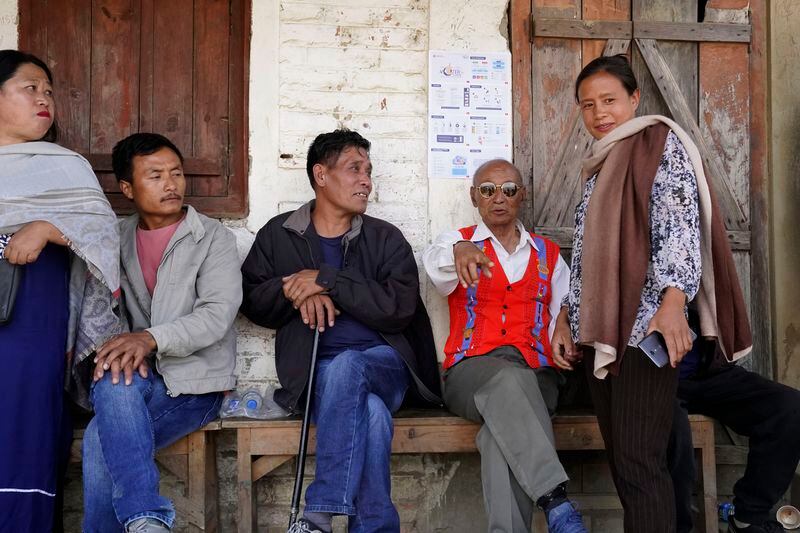 Tangkhul Nagas rest outside a polling station in Ukhrul, in the northeastern Indian state of Manipur, Friday, April 26, 2024. (AP Photo/Yirmiyan Arthur)
