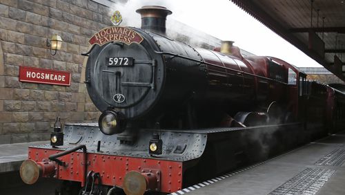 The Hogwarts Express arrives at Hogsmeade station during a preview of Diagon Alley at the Wizarding World of Harry Potter at Universal Orlando, Thursday, June 19, 2014, in Orlando, Fla. (AP Photo/John Raoux)