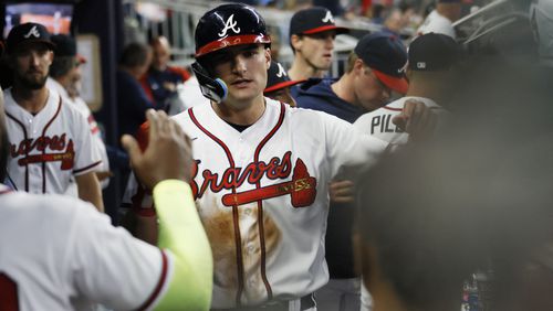 Braves center fielder Sam Hilliard (14) celebrates his run with teammates at the bottom of the seventh inning against the Cincinnati Reds on Wednesday, April 12, 2023, at Truist Park in Atlanta.
 Miguel Martinez /miguel.martinezjimenez@ajc.com