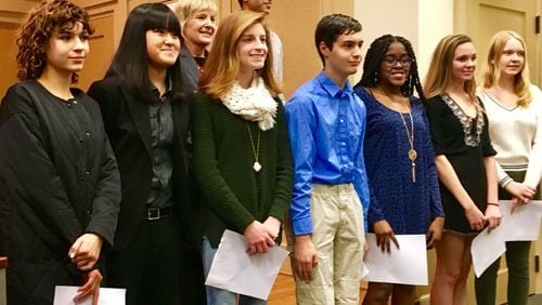 Decatur’s first ever youth council, recently sworn during a city commission meeting, shown here with Mayor Patti Garrett in the back row. The council’s comprised of nine students from Decatur High and Academe of the Oaks. All must live within city limits. Bill Banks for the AJC