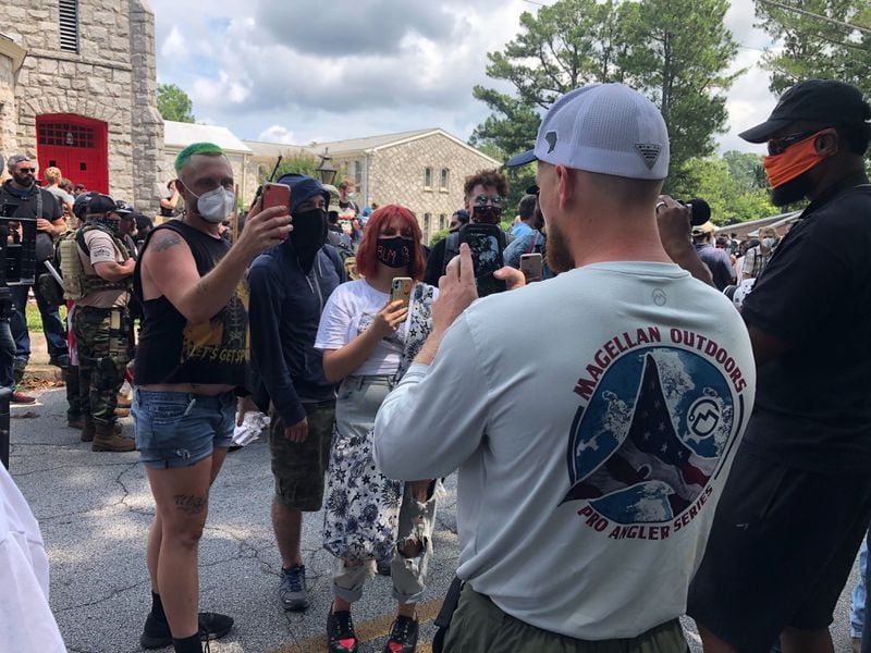 Saturday, Aug. 15, 2020, Stone Mountain -- Counterprotesters and militia members confront one another, often filming the exchanges.