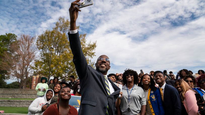 FILE — Sen. Raphael Warnock (D-Ga.) greets students at Fort Valley State University in Fort Valley, Ga., Nov. 1, 2022. Warnock, a son of Savannah public housing who rose to become Georgia’s first Black senator, secured a full six-year term and a spot among Democrats’ rising stars. (Nicole Craine/The New York Times)