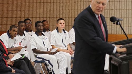 Inmate students listen to Gov. Nathan Deal's remarks during a ceremony to officially open the school. The first of what Gov. Nathan Deal envisions to be a statewide network of prison-based charter schools officially opened Thursday at the Burruss Correctional Institute in middle Georgia. Deal was on hand for the opening of the Foothills Education Charter School. BOB ANDRES / BANDRES@AJC.COM