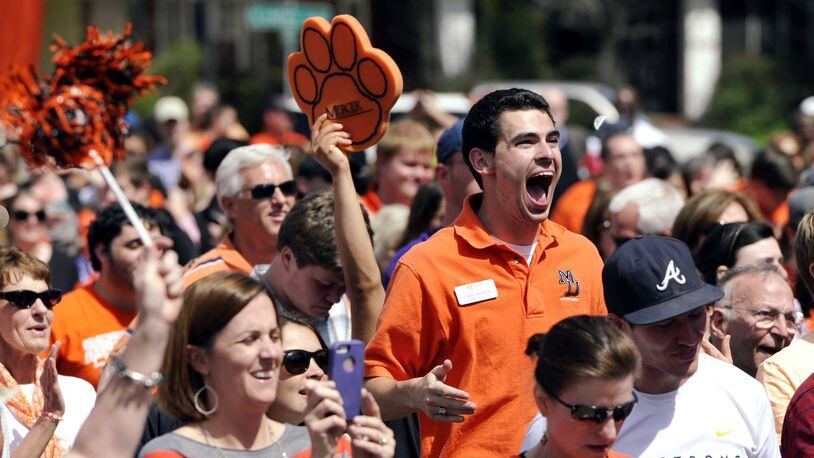 Mercer University fans enjoy seeing the clock run out at their viewing party Friday, March 21, 2014, in Macon, Ga., as the Bears upset Duke, 78-71 in an NCAA college basketball tournament game. (AP Photo/The Telegraph, Woody Marshall)