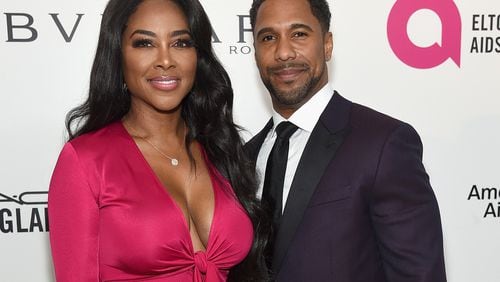 WEST HOLLYWOOD, CA - MARCH 04:  (L-R) Kenya Moore and Marc Daly attend the 26th annual Elton John AIDS Foundation's Academy Awards Viewing Party at The City of West Hollywood Park on March 4, 2018 in West Hollywood, California.  (Photo by Jamie McCarthy/Getty Images for EJAF)