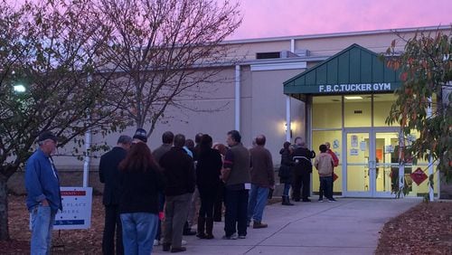 People line up to vote before the polls open at the Tucker precinct on Main Street in the DeKalb County city. JOSHUA SHARPE/JOSHUA.SHARPE@AJC.COM