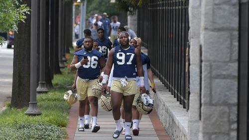 Georgia Tech football players arrive at Rose Bowl Field for the first day of Georgia Tech football practice on Friday, August 4, 2017. HYOSUB SHIN / HSHIN@AJC.COM