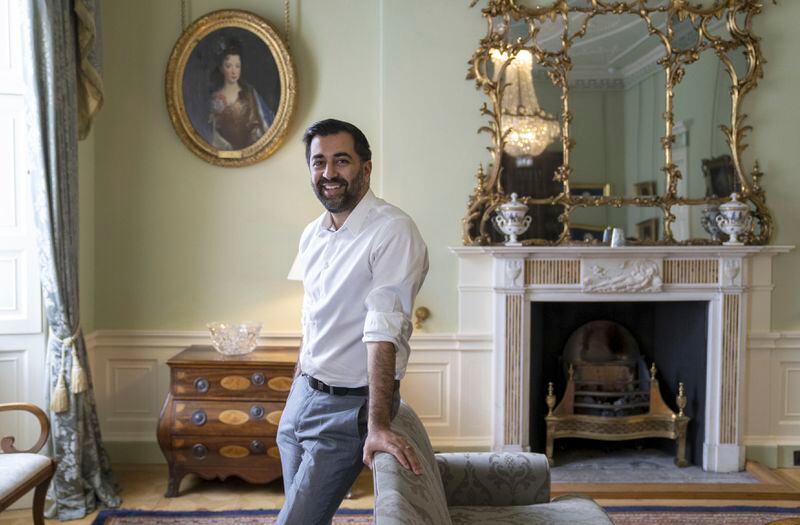 FILE - Scotland's First Minister Humza Yousaf, poses for a photo, at Bute House in Edinburgh, ahead of the SNP National Conference, Oct. 12, 2023. Scotland’s first minister, Humza Yousaf, has resigned on Monday, April 29, 2024, rather than face a no-confidence vote just days after he torpedoed a coalition with the Green Party by ditching a target for fighting climate change. (Jane Barlow/PA via AP, File)