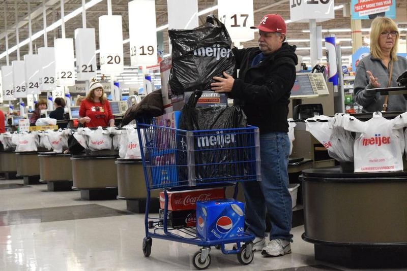 Hundreds of shoppers waited in lines at the Kettering Meijer Thanksgiving morning for televisions, Apple products and other deals.