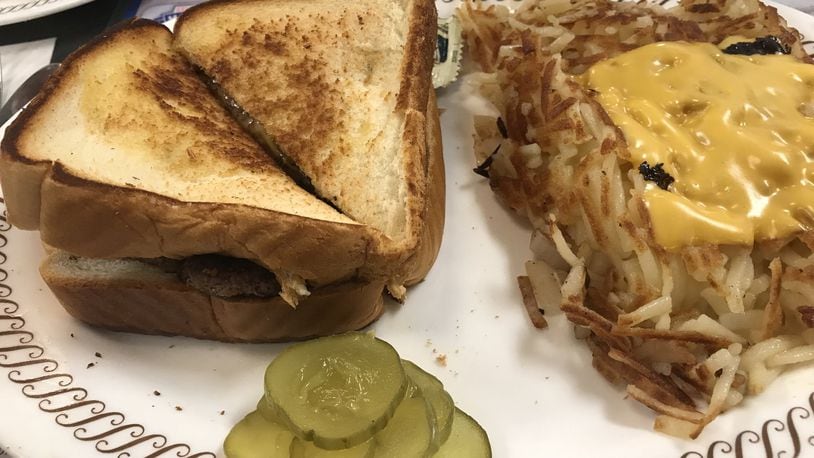 A patty melt with hash browns smothered and covered at Waffle House. LIGAYA FIGUERAS / LFIGUERAS@AJC.COM