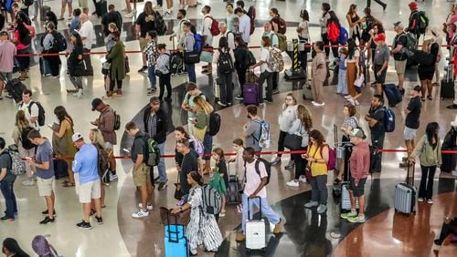 Hartsfield-Jackson International Airport’s domestic atrium, seen on Friday, Sept. 1, 2023, fills up with long lines of travelers waiting to go through security on busy days. (John Spink / John.Spink@ajc.com)