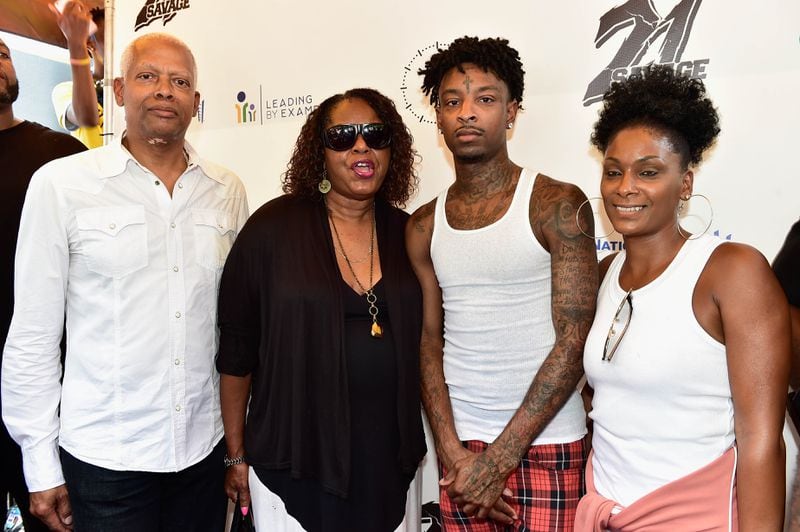 U.S. Rep. Hank Johnson and his wife, DeKalb County Commissioner Mereda Davis, with 21 Savage and the artist’s mom, Heather Joseph, at the August back-to-school drive. Photo: Moses Robinson/Getty Images North America