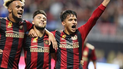 Atlanta United players Anton Walkes and Hector Villalba joins Yamil Asad (right) after he scored the second goal of the team during the first half against the LA Galaxy
