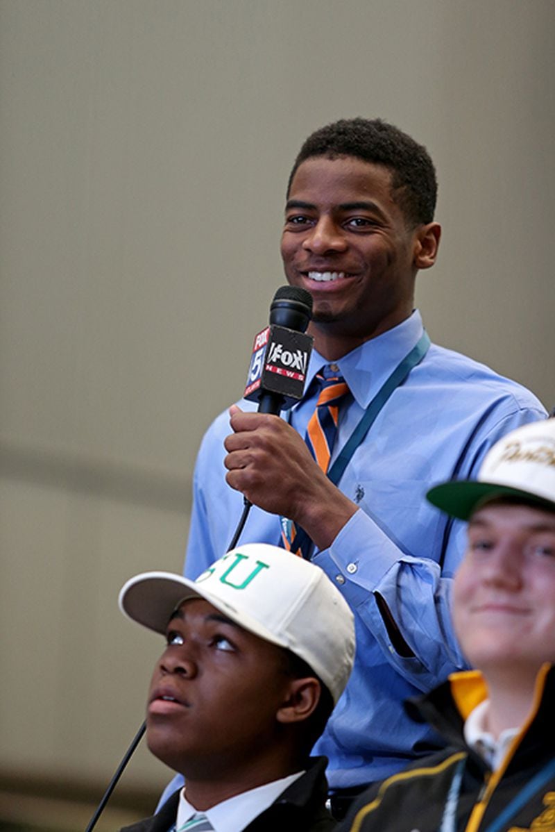Greater Atlanta Christian's Darius Slayton answers questions about choosing Auburn during the Signing Day festivities Feb. 4, 2015, at the College Football Hall of Fame and Chick-fil-A fan experience in Atlanta.