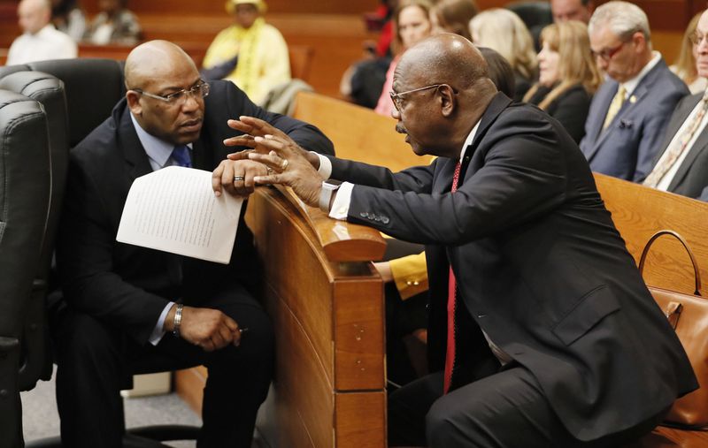 4/23/18 - Atlanta - Chief Assistant District Attorney Clint Rucker (left) talks with Fulton County District Attorney Paul Howard, Jr., as the court took up discussion of questions from the jury.   The jury resumed their fifth day of deliberations this morning during the Tex McIver murder trial at the Fulton County Courthouse.   Bob Andres bandres@ajc.com
