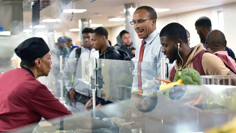 Morehouse College interim president Harold Martin eats with students in the crowded cafeteria on campus on Wednesday, Aug. 30, 2017. A HYOSUB SHIN / HSHIN@AJC.COM