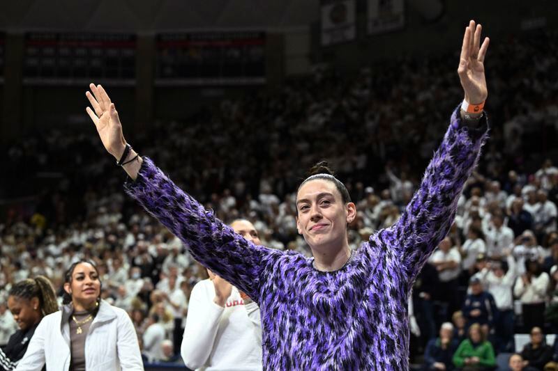 FILE - Former UConn player and WNBA player Breanna Stewart acknowledges the crowd after being introduced before UConn's NCAA college basketball game against Notre Dame on Saturday, Jan. 27, 2024, in Storrs, Conn. A’ja Wilson, Breanna Stewart and Brittney Griner will be back on the courts chasing another WNBA title when camps open on Sunday, April 28. (Cloe Poisson/Hartford Courant via AP, File)