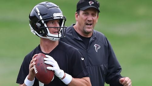 Atlanta Falcons quarterbacks coach Greg Knapp works with Matt Ryan during team practice on Tuesday, June 5, 2018, in Flowery Branch.