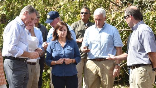 U.S. Sen. David Perdue (L-R), Karen Pence and her husband, Vice President Mike Pence and his wife Karen Pence on a tour to inspect the damage wrought by Hurricane Michael in in October 2018. HYOSUB SHIN / HSHIN@AJC.COM