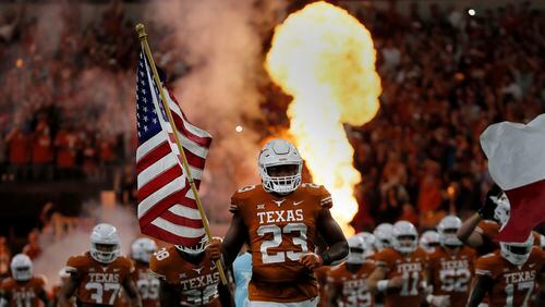 Texas Longhorns Jeffrey McCulloch (23) runs onto the field before the first half of the Big 12 Conference football championship against the Oklahoma Sooners, Saturday, Dec. 1, 2018, in Arlington, Texas. Oklahoma defeated Texas 39-27. (Roger Steinman/AP)