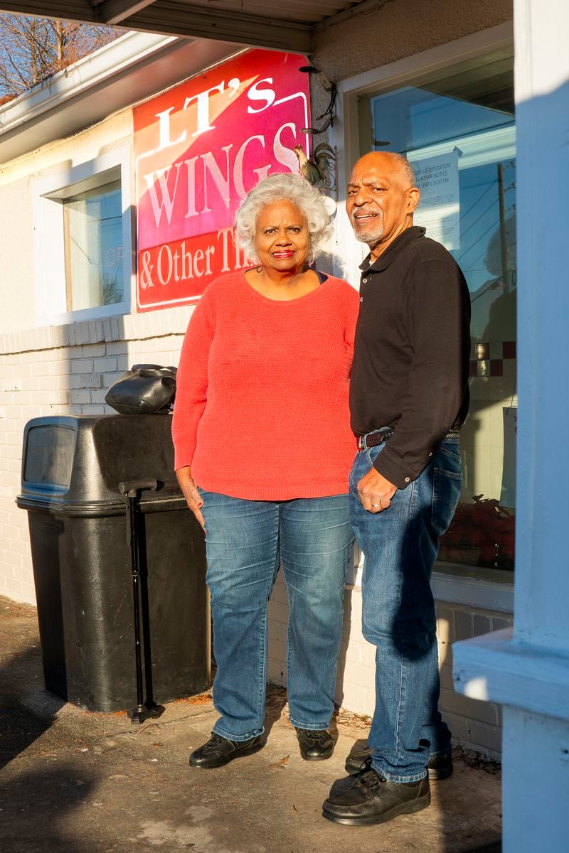 Doris and George Jeter stand outside of LT's Wings in southwest Atlanta. The Jeters purchased the business in 2002.