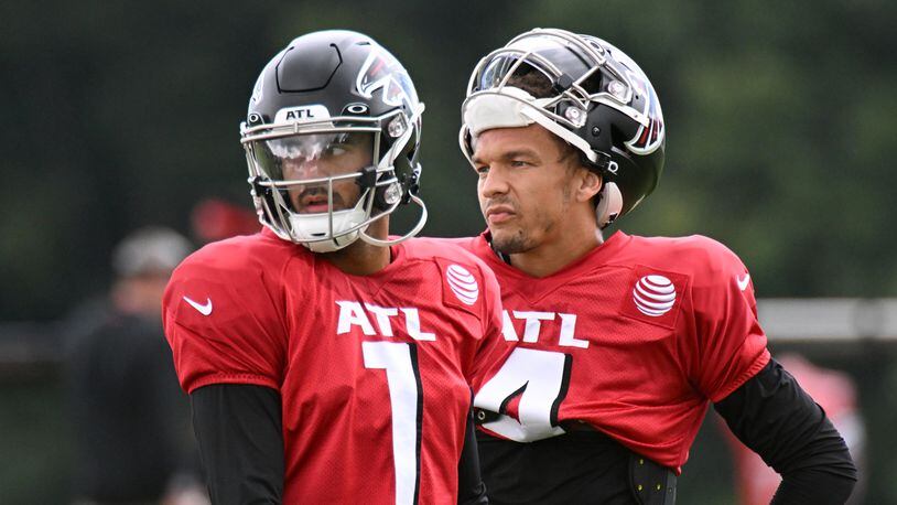 Atlanta Falcons' quarterbacks Marcus Mariota (1) and Desmond Ridder (4) participate in a joint practice with theJacksonville Jaguars at the Falcons Practice Facility in Flowery Branch on Aug. 25, 2022. (Hyosub Shin / Hyosub.Shin@ajc.com)