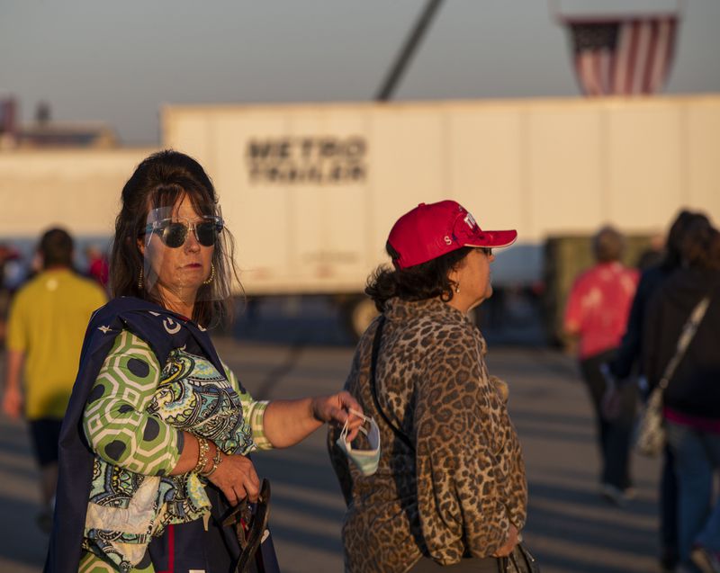 10/16/2020 -Macon, Georgia -  A President Donald Trump supporter wears a face shield during a Trump rally at Middle Georgia Regional Airport in Macon, Friday, October 16, 2020.  (Alyssa Pointer / Alyssa.Pointer@ajc.com)