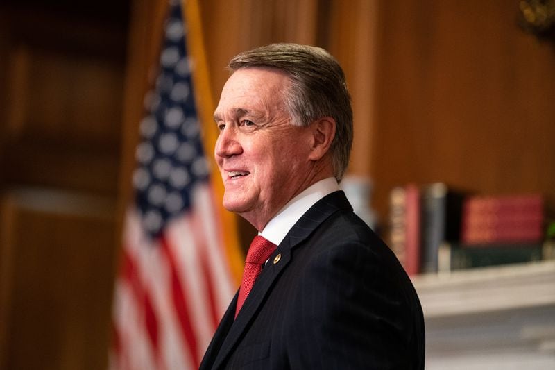 Sen. David Perdue (R-GA) meets with Seventh U.S. Circuit Court Judge Amy Coney Barrett, President Donald Trump's nominee for the U.S. Supreme Court, before a meeting at the Capitol Building in Washington D.C., on September 30, 2020. (Anna Moneymaker/Pool/Getty Images/TNS)