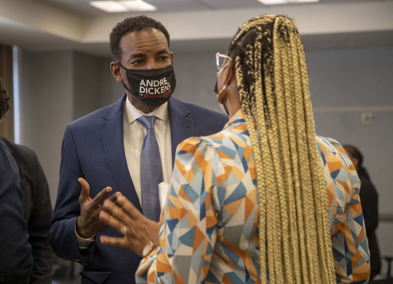 Atlanta mayoral candidate Andre Dickens speaks with a constituent following a forum hosted by Partners for HOME and Policing Alternatives & Diversion Initiative at the Institute of Technology Hotel and Conference Center in Atlanta.  (Alyssa Pointer/Atlanta Journal Constitution)