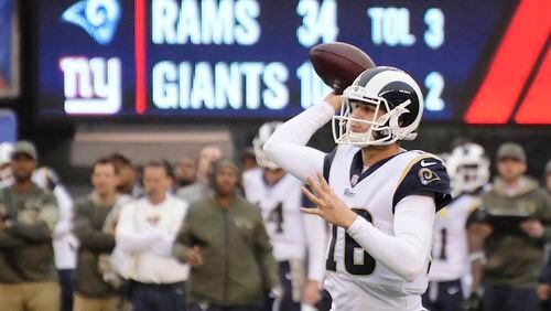 Los Angeles Rams quarterback Jared Goff (16) throws a pass to Robert Woods for a touchdown during the second half of an NFL football game New York Giants Sunday, Nov. 5, 2017, in East Rutherford, N.J. (AP Photo/Bill Kostroun)