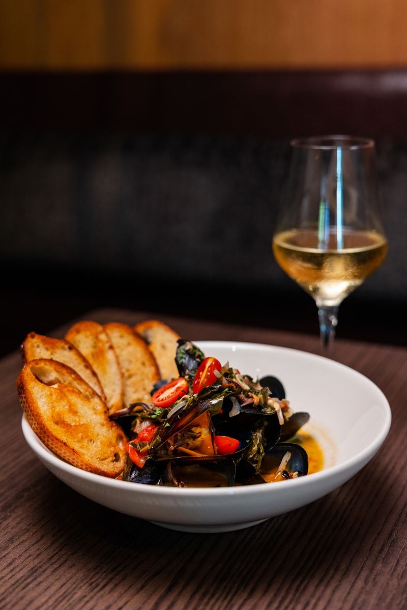 Mussels and collard greens, a dish that chef Duane Nutter originally created for One Flew South, is on the menu at Southern National. Courtesy of Rebecca Carmen