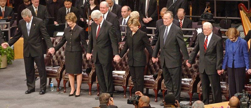 U.S. Sen. Hillary Clinton attends the funeral service for Coretta Scott King, wife of Dr. Martin Luther King, Jr., at the New Birth Missionary Baptist Church on Feb. 6, 2006. Pictures with her are President George W. Bush, First Lady Laura Bush, Bill Clinton, George H.W. Bush, Jimmy Carter and his wife, Rosalynn.