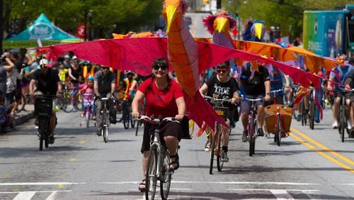 Chantelle Rytter, with her red Phoenix, leads the pack of bicycle riders at the start of the Atlanta Streets Alive ride Sunday, April 7, 2019. STEVE SCHAEFER / SPECIAL TO THE AJC