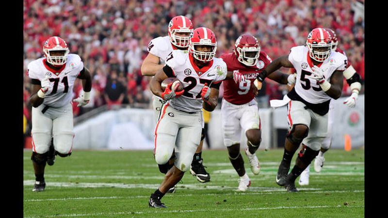 Nick Chubb #27 of the Georgia Bulldogs runs for a 50 yard touchdown in the 2018 College Football Playoff Semifinal Game against the Oklahoma Sooners at the Rose Bowl Game. Getty Images