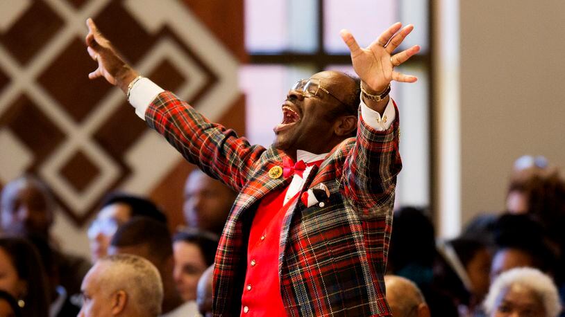 Cal Merrell, otherwise known as "The Happy Preacher" and whose last name was sometimes spelled Murrell by others, shouts out during during the Rev. Martin Luther King Jr. holiday commemorative service at Ebenezer Baptist Church where King preached, Monday, Jan. 18, 2016, in Atlanta. (AP Photo/David Goldman)