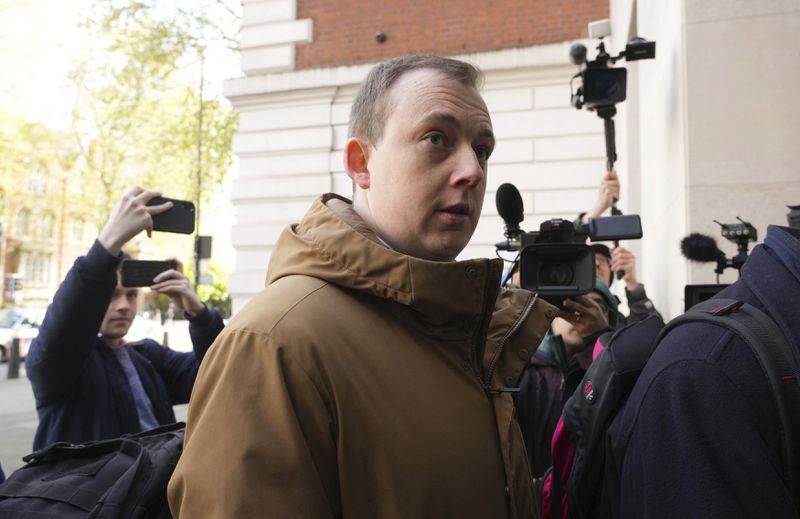 Christopher Berry arrives at Westminster Magistrates' Court where he faces an Official Secrets Act charge related to allegedly gathering information for China, in London, Friday April 26, 2024. (Jeff Moore/PA via AP)