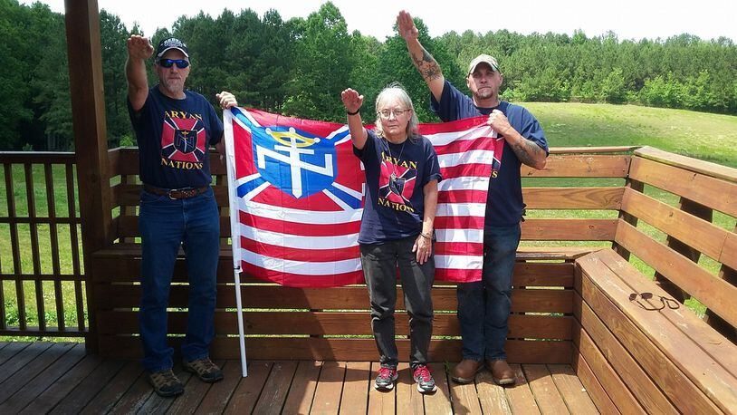 Members of the Villa Rica-based Aryan Nations Worldwide salute in a photo from the group’s Facebook page.