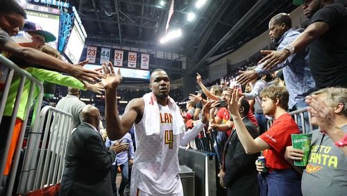 Atlanta Hawks Paul Millsap gets high fives from fans after defeating the Washington Wizards 111-101 in Game 4 of a first-round NBA basketball playoff series on Monday, April 24, 2017, in Atlanta. Curtis Compton/ccompton@ajc.com