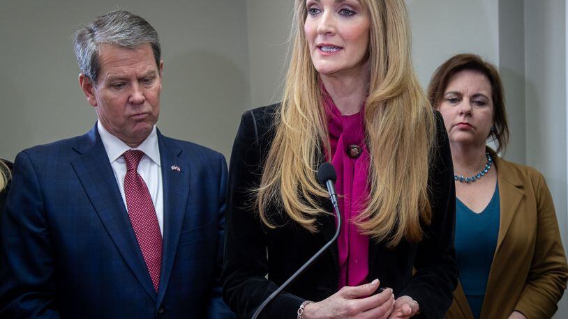 U.S. Senator Kelly Loeffler flanked by Gov. Brian Kemp (L) and Susan B. Anthony List President Marjorie Dannenfelser (R) speaks during a press conference at the First Care Womenâs Clinic in Marietta Friday, February 14, 2020.  (Steve Schaefer for The Atlanta Journal-Constitution)