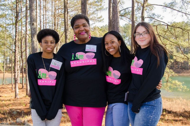 Zenobia Edwards and girls attending the Pink Pajama Jam from South Carolina take in the lake scenery at Lanier Islands Resort. Edwards is co-founder of the nonprofit I Am B.E.A.U.T.I.F.U.L. CONTRIBUTED