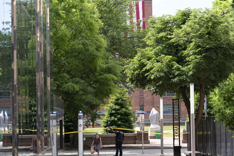The George Washington University yard is seen cleaned after workers carried away students tents after police cleared the encampment as they were protesting over the Israel-Hamas war on Wednesday, May 8, 2024, in Washington. (AP Photo/Jose Luis Magana)