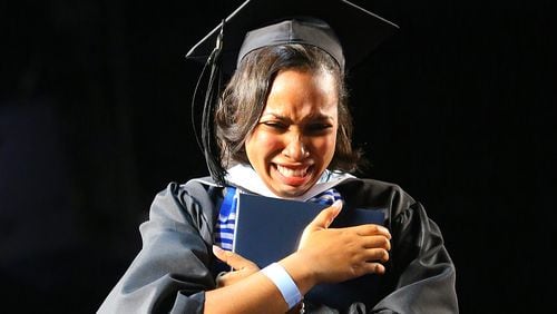 An emotional Tiffany Greene at Spelman College's commencement: "Being able to walk across the stage was a victory for me. But it was also just, you know, the end of a really hard journey." (Curtis Compton / ccompton@ajc.com)
