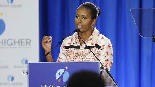 First lady Michelle Obama speaks about her Reach Higher initiative to students during a visit to Atlanta's Washington High School. The program is geared toward increasing the nation's number of college graduates.
