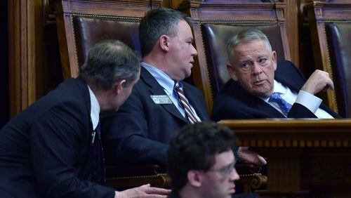 Speaker of the House David Ralston (right) confers with Rep. Ed Setzler (left), during Crossover Day on Thursday. HYOSUB SHIN / HSHIN@AJC.COM