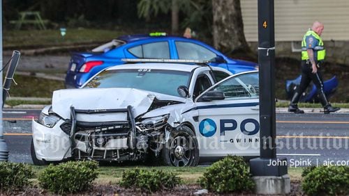 All lanes of Scenic Highway were shut down after a Gwinnett County police officer crashed Thursday morning.